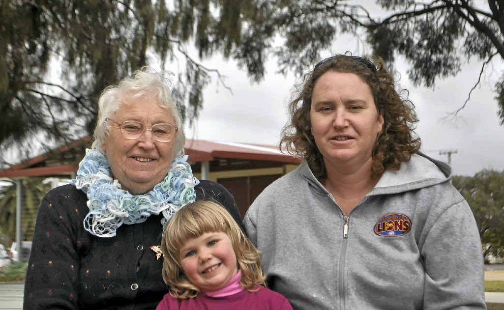 Dell Free, Lilly Phyland and Delma Phyland braved the cold and rain.